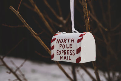 Close-up of heart shape sign hanging