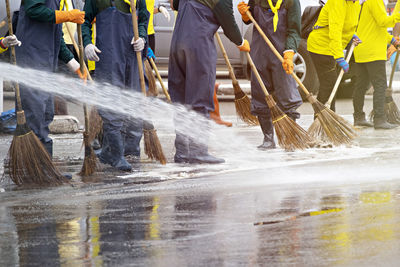 Low section of people working in water