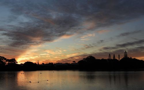 Scenic view of lake against sky during sunset