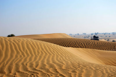 Scenic view of desert against clear sky