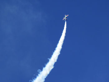 Low angle view of airplane against sky