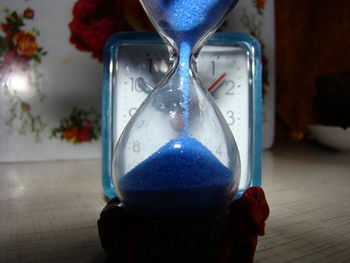 Close-up of clock on table