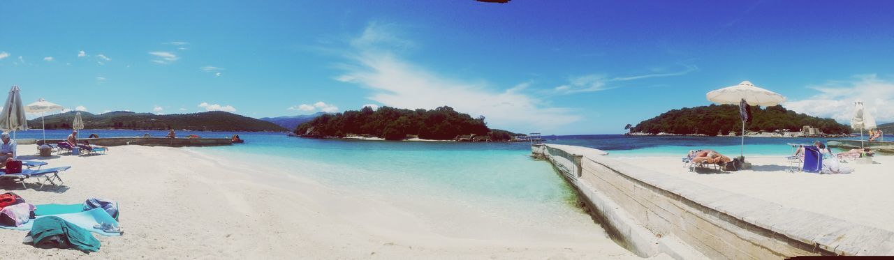 beach, sea, sand, water, shore, blue, sky, vacations, horizon over water, scenics, beach umbrella, beauty in nature, tranquil scene, tranquility, parasol, incidental people, nature, leisure activity, panoramic