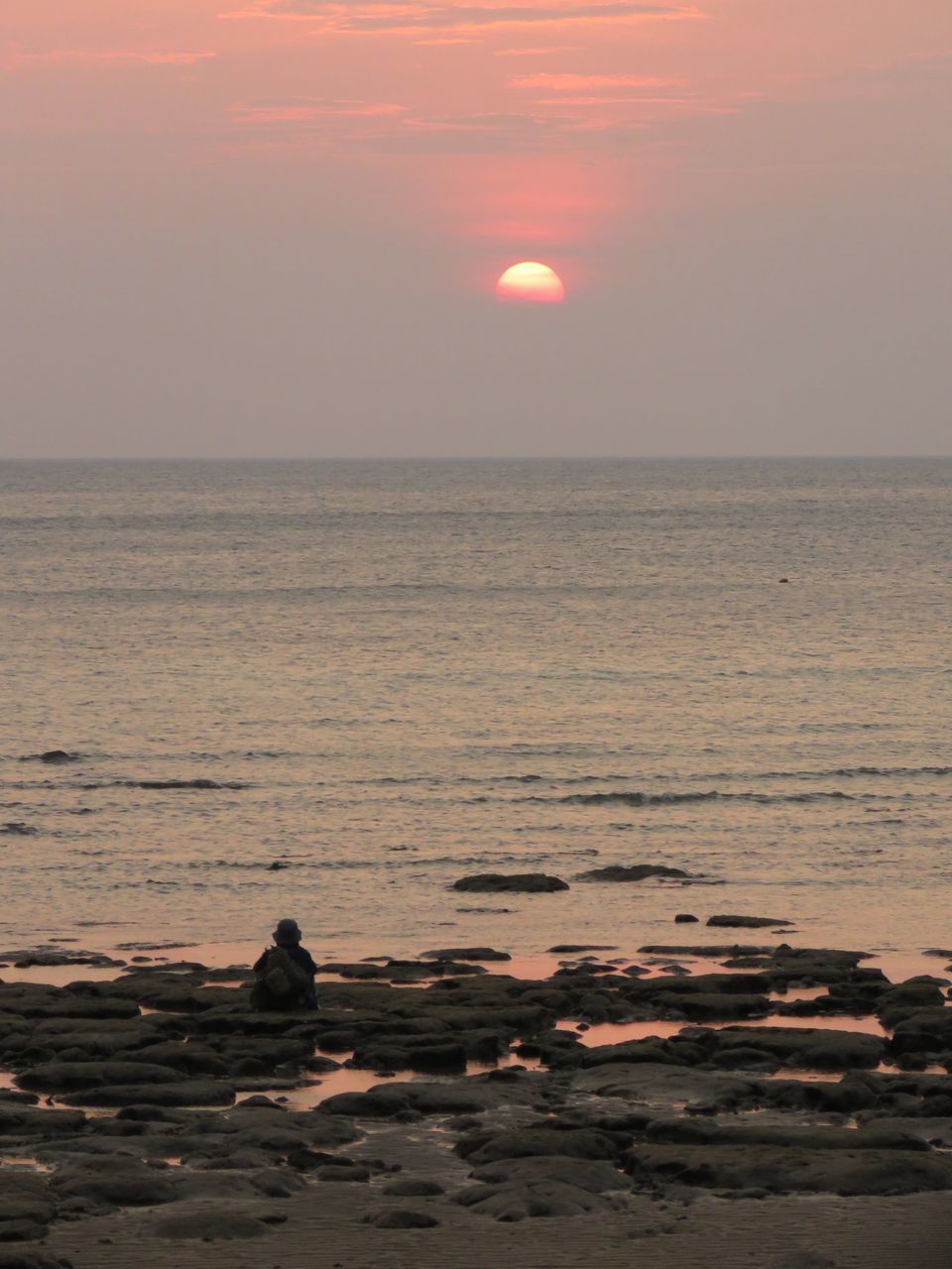 SCENIC VIEW OF SEA AGAINST ORANGE SKY