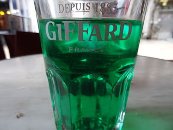 Close-up of beer glass on table