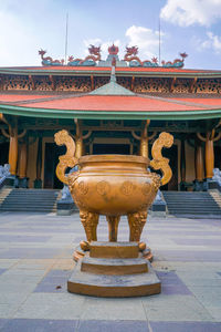 Statue in temple against building