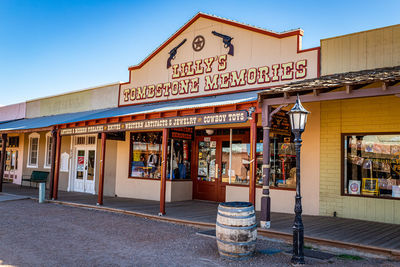 Information sign on restaurant against clear sky