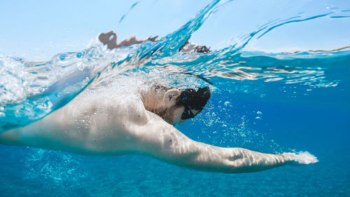 Man swimming in sea