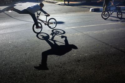 Man riding bicycle on road