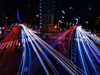 High angle view of light trails on road at night