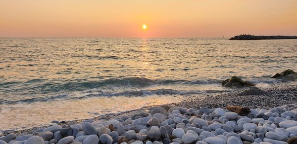 Scenic view of sea against sky during sunset