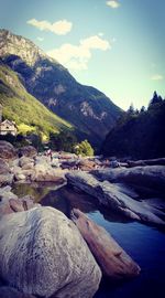 Scenic view of lake and mountains against sky