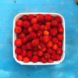 High angle view of strawberries in container on table