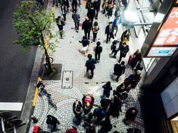 High angle view of people walking in city