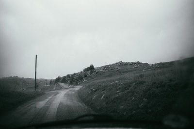 Road seen through car windshield