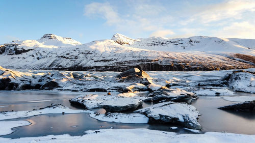 Scenic view of snowcapped mountains against sky