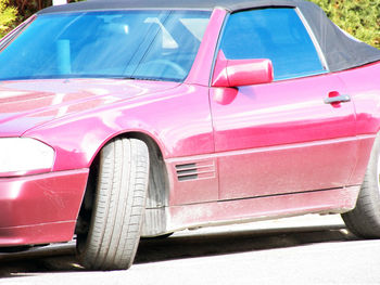 Close-up of vintage car on street
