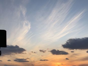 Low angle view of silhouette street light against sky during sunset