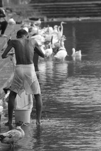 Rear view of a man in river