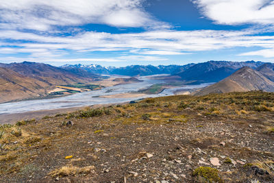 Scenic view of landscape and mountains against sky