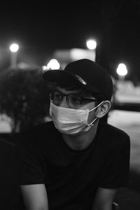 Portrait of young man sitting outdoors