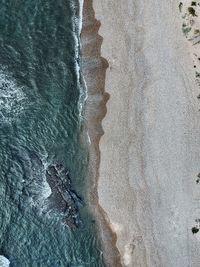 High angle view of waves on beach