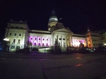 Facade of historic building at night