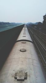 View of railroad tracks against clear sky