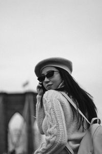 Woman wearing sunglasses against sky