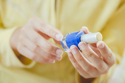 Close-up of woman holding hands