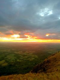 Scenic view of field against sky during sunset