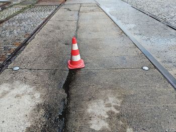 High angle view of red traffic cone on road