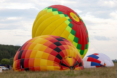 Low angle view of hot air balloons against sky