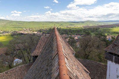 Panoramic view of landscape and houses against sky