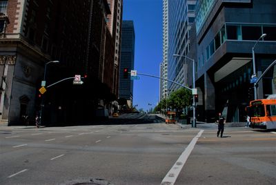 Vehicles on road along buildings