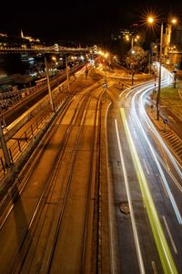 High angle view of light trails on city street at night