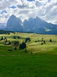 Scenic view of landscape and mountains against sky