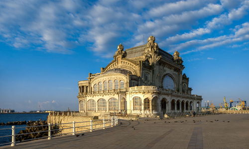 Facade of historic building against sky