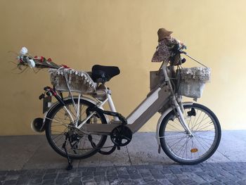 Bicycle parked against wall