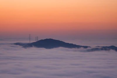 Scenic view of mountains against sky during sunset