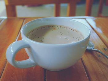 Close-up of coffee cup on table