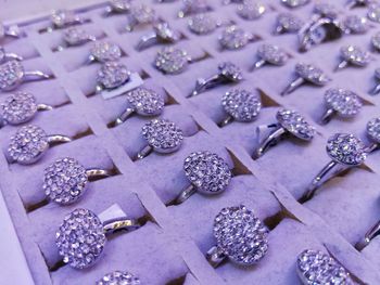 Full frame shot of diamond rings in box at store