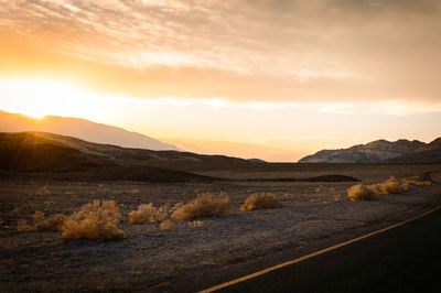 Scenic view of landscape against sky during sunset