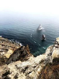 High angle view of rocks on sea