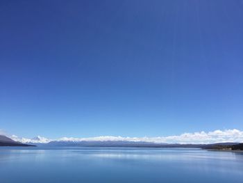 Scenic view of sea against clear blue sky