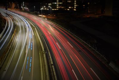 High angle view of light trails on highway at night
