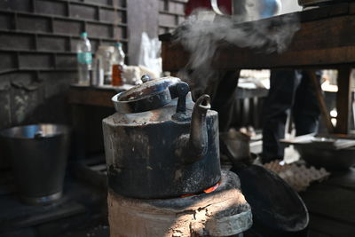 Making indian style hot tea or chai for customers on the street.