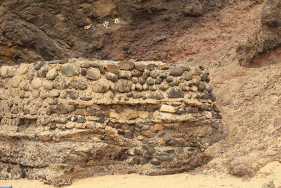 Stone wall on rock