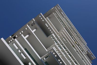 Low angle view of building against clear blue sky