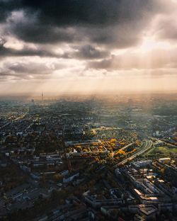 Aerial view of illuminated city at dusk